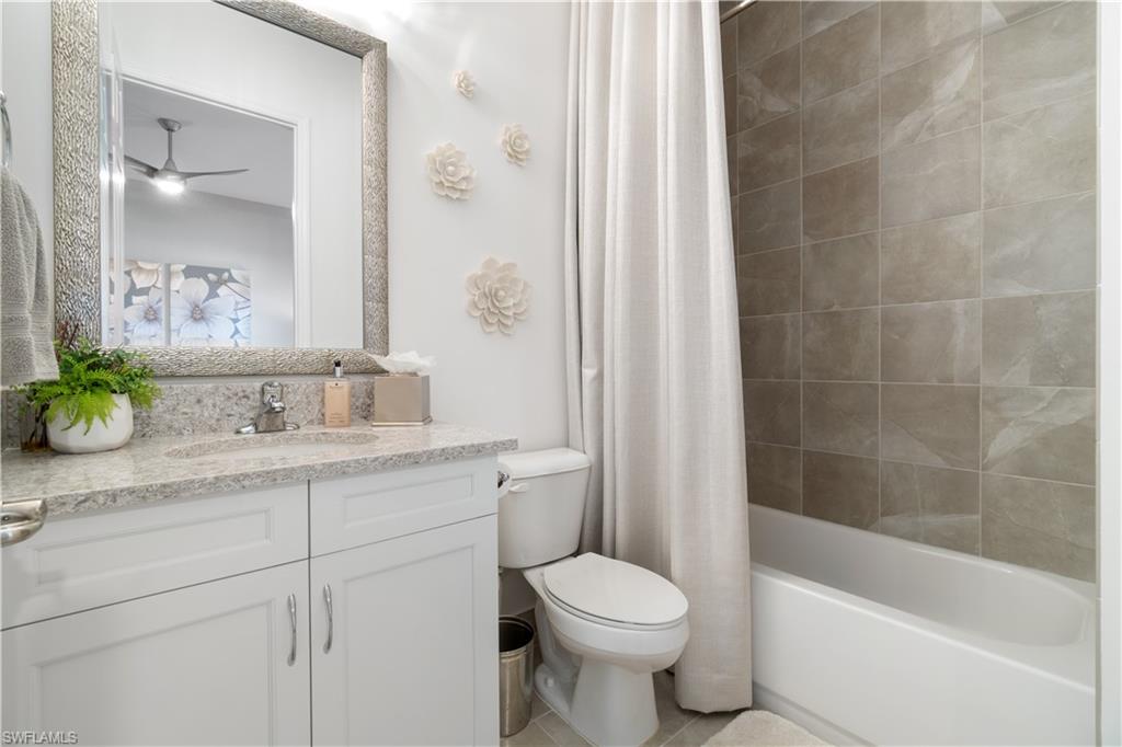 4467 Caldera Circle Naples, FL 34119 - Photo 28 of 50 a bathroom with a sink a toilet and shower