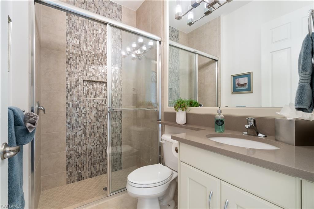 4467 Caldera Circle Naples, FL 34119 - Photo 30 of 50 a bathroom with a sink a toilet and shower