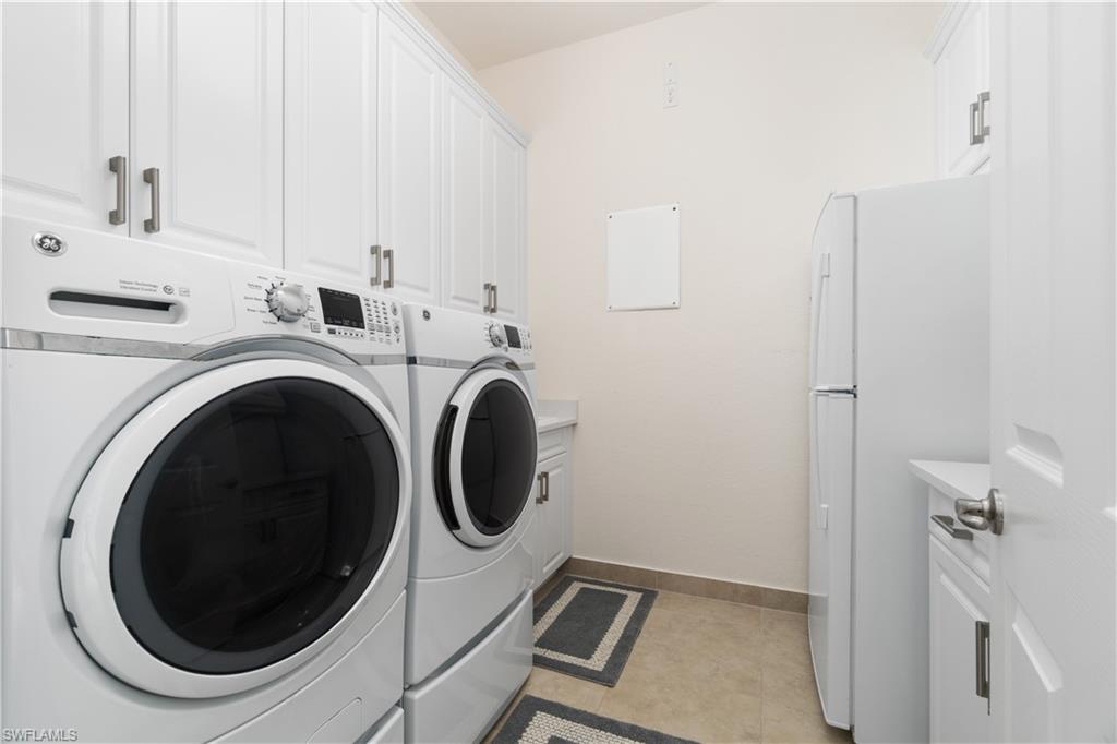 4467 Caldera Circle Naples, FL 34119 - Photo 33 of 50 a utility room with dryer and washer