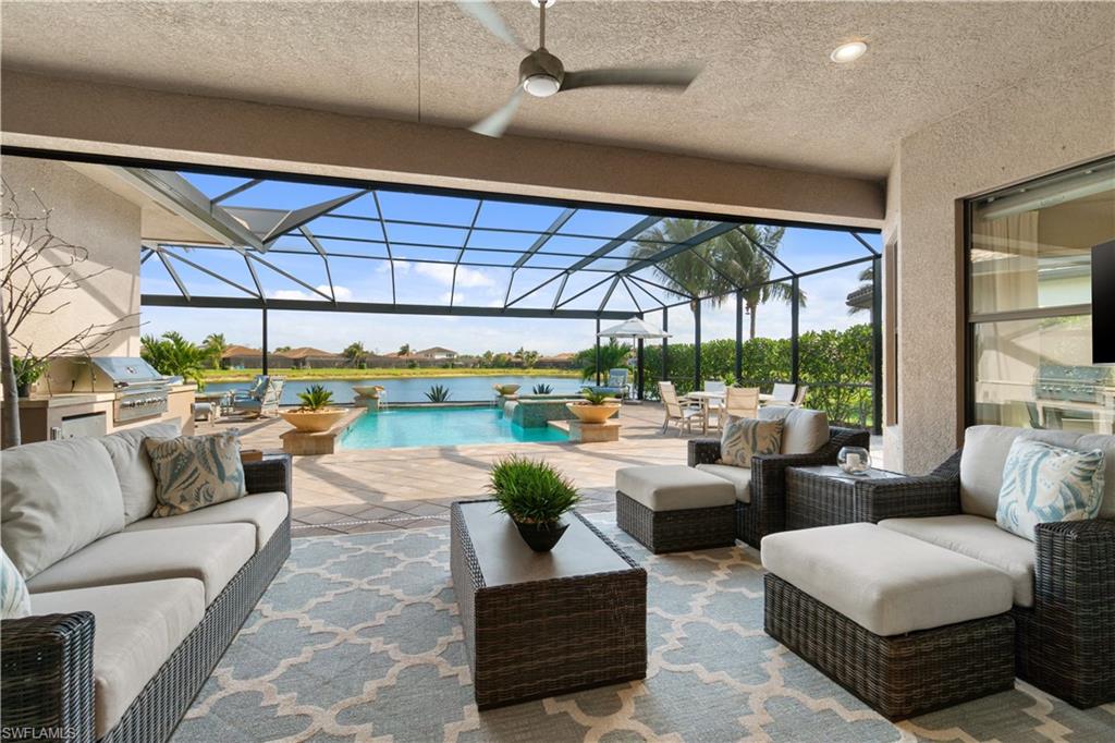 4467 Caldera Circle Naples, FL 34119 - Photo 36 of 50 a living room with furniture and a large window