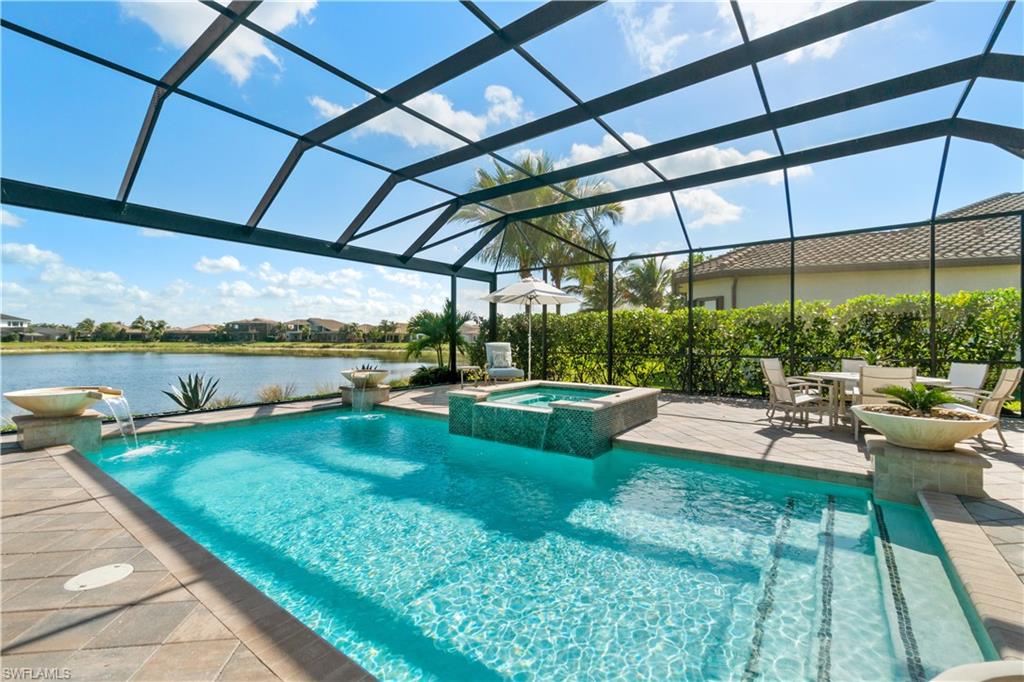 4467 Caldera Circle Naples, FL 34119 - Photo 39 of 50 a view of swimming pool with garden and patio