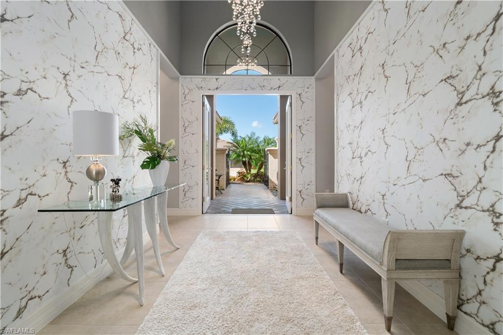 4467 Caldera Circle Naples, FL 34119 - Photo 7 of 50 a view of a hallway with couches and potted plant