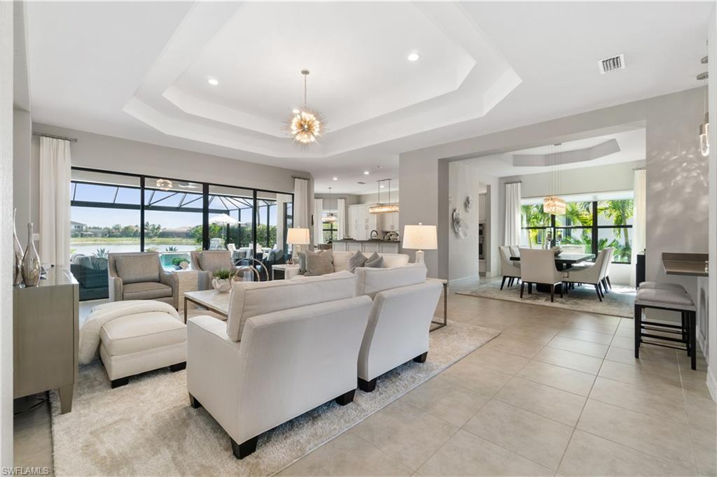 4467 Caldera Circle Naples, FL 34119 - Photo 9 of 50 a living room with furniture and a large window