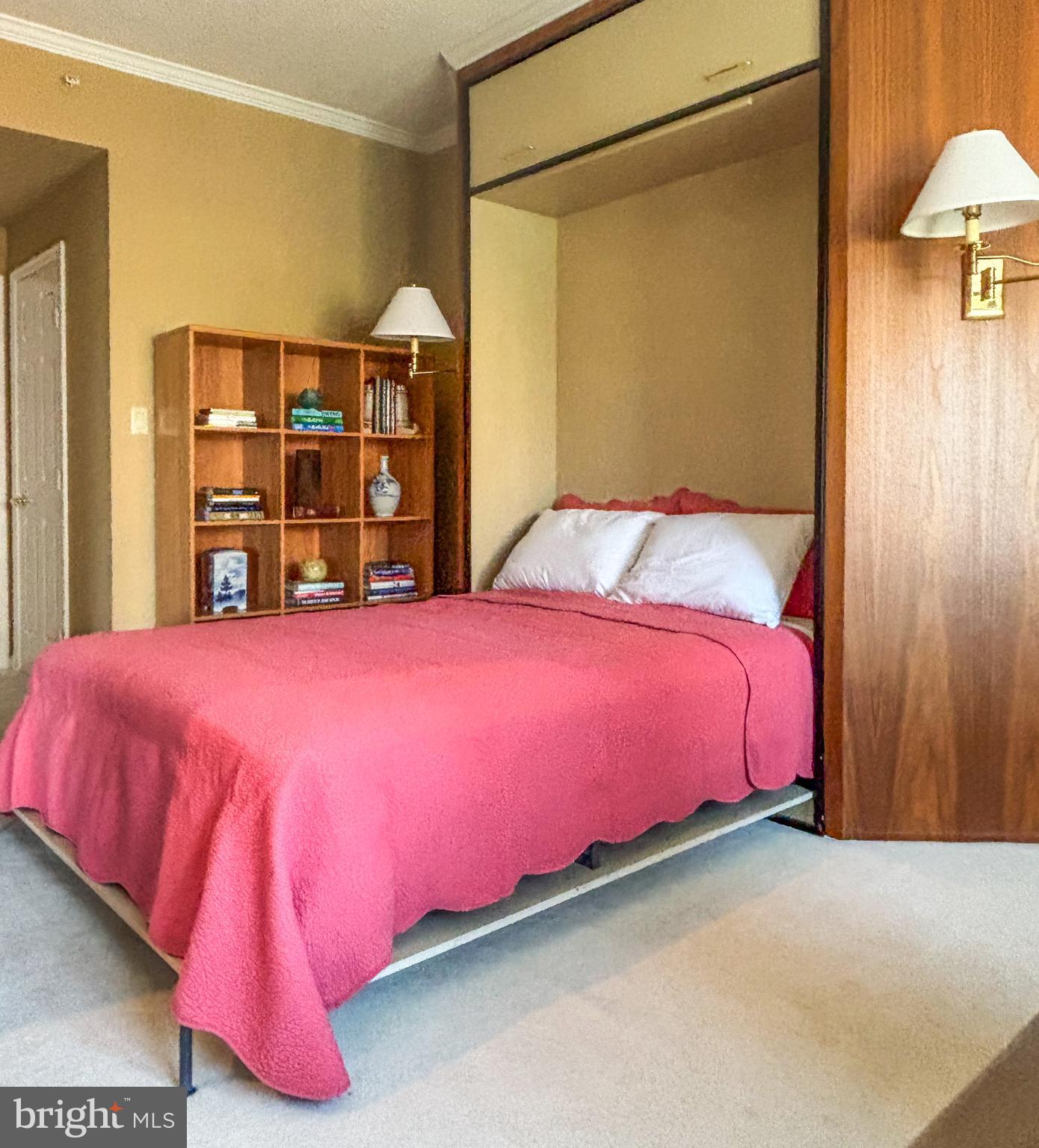 3801 Canterbury Road, Unit 816 Baltimore, MD 21218 - Photo 23 of 29 a bed room with a bed and a lamp