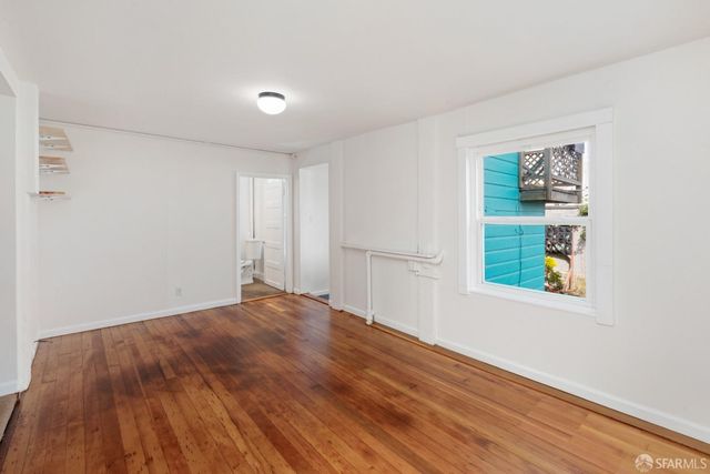 a view of a room that has a window in it