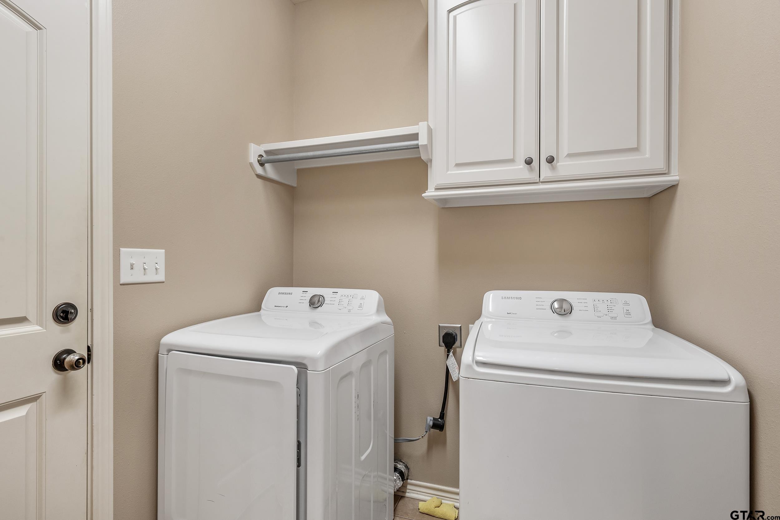 5841 Havens Trail Tyler, TX 75707 - Photo 13 of 21 a utility room with dryer and washer