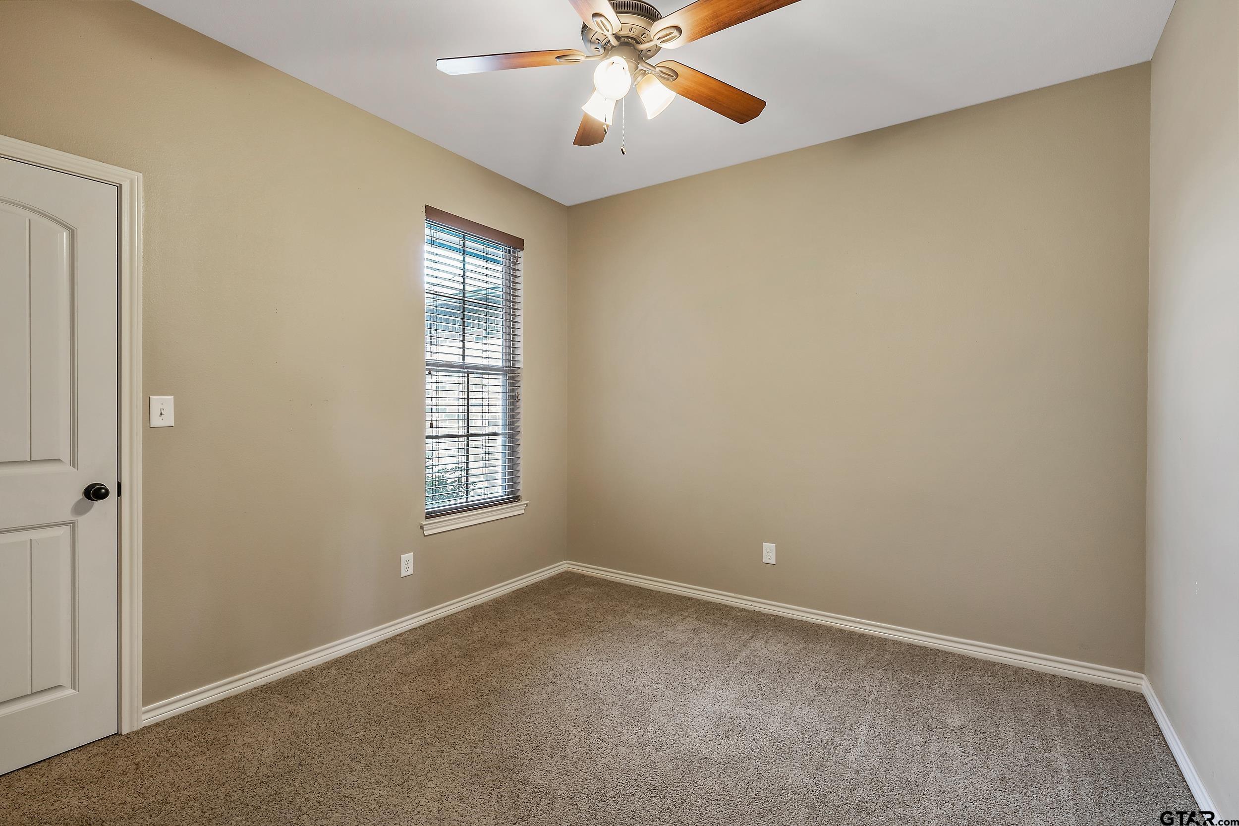 5841 Havens Trail Tyler, TX 75707 - Photo 14 of 21 wooden floor in an empty room with a window