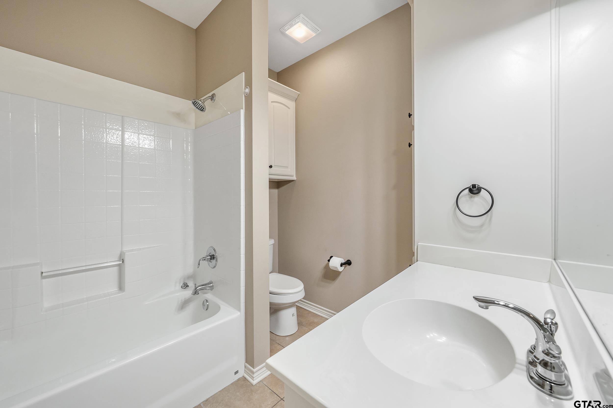 5841 Havens Trail Tyler, TX 75707 - Photo 15 of 21 a bathroom with a tub a sink and a shower