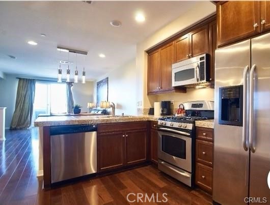 1415 Abelia Irvine, CA 92606 - Photo 1 of 13 a kitchen with stainless steel appliances granite countertop a stove a sink and a refrigerator