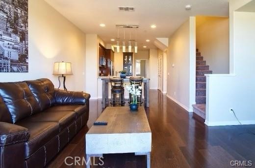 1415 Abelia Irvine, CA 92606 - Photo 4 of 13 a living room with furniture and a wooden floor