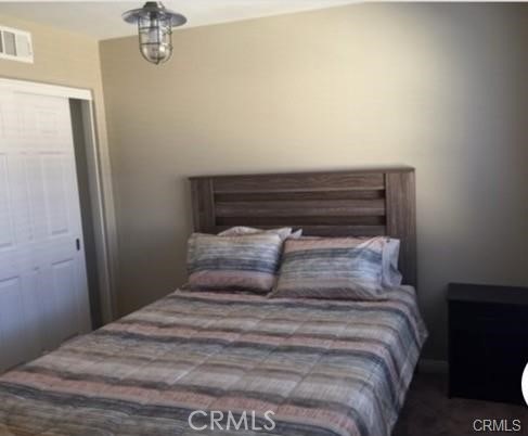 1415 Abelia Irvine, CA 92606 - Photo 7 of 13 a bedroom with a bed and a mirror