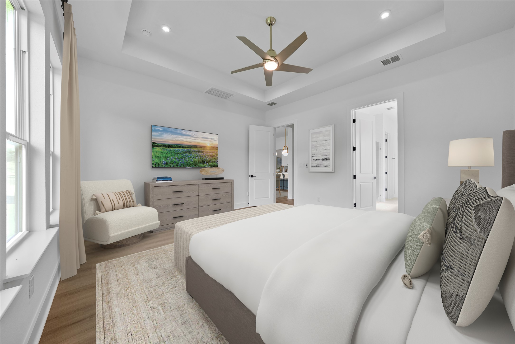 263 Iron Willow Loop Dripping Springs, TX 78620 - Photo 12 of 26 a spacious bedroom with a bed and ceiling fan