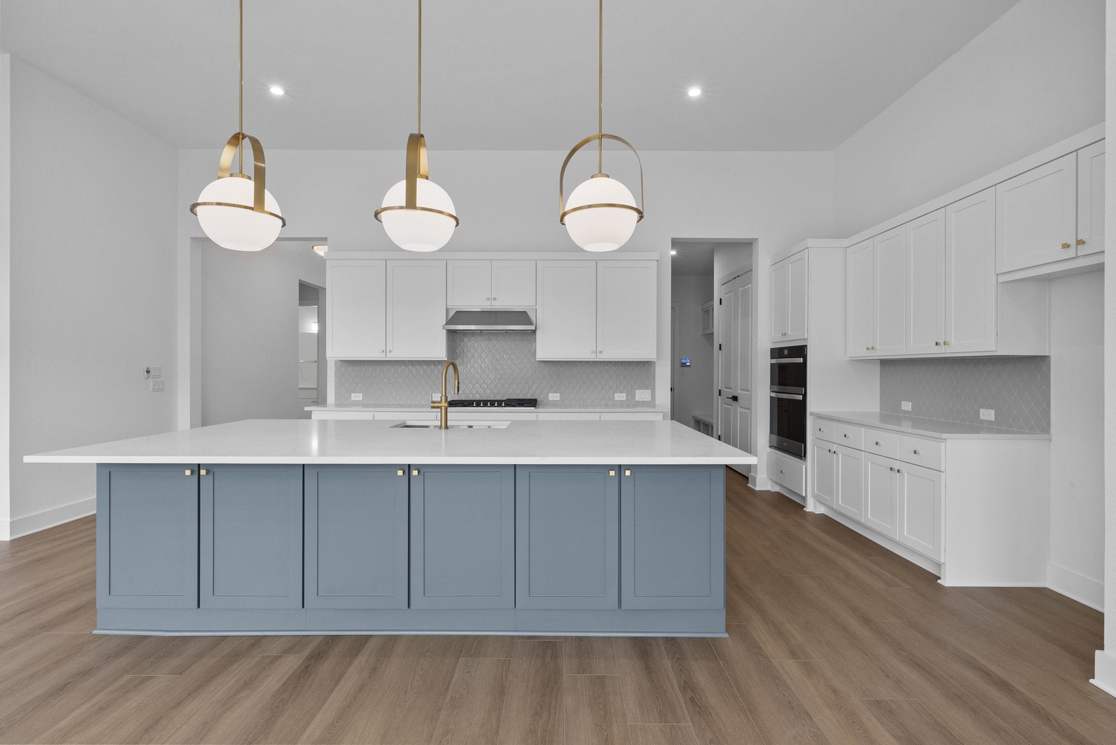 263 Iron Willow Loop Dripping Springs, TX 78620 - Photo 18 of 26 a kitchen with a sink cabinets and wooden floor