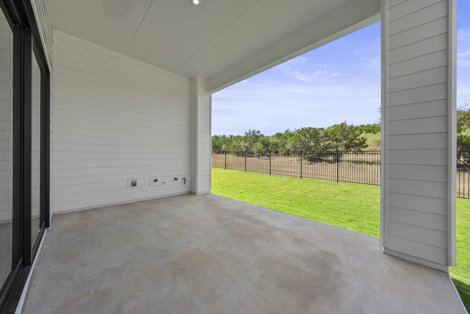 263 Iron Willow Loop Dripping Springs, TX 78620 - Photo 25 of 26 a view of a yard and porch