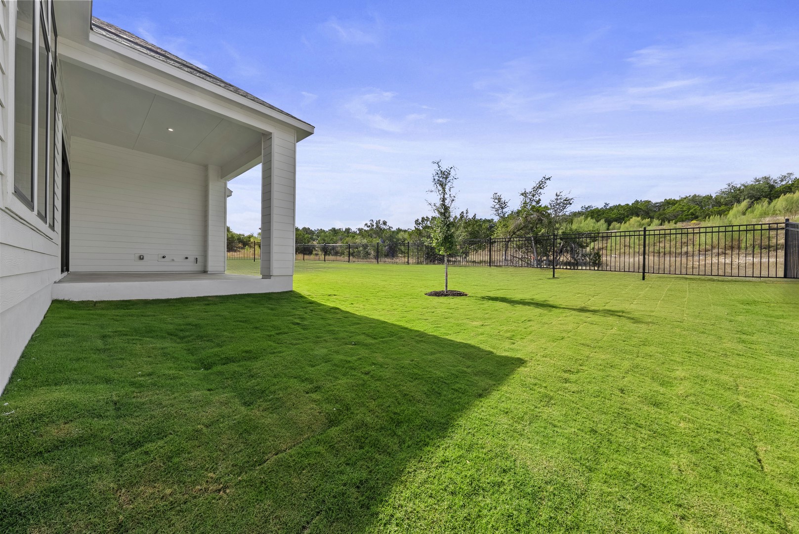 263 Iron Willow Loop Dripping Springs, TX 78620 - Photo 26 of 26 a view of a golf course with a park
