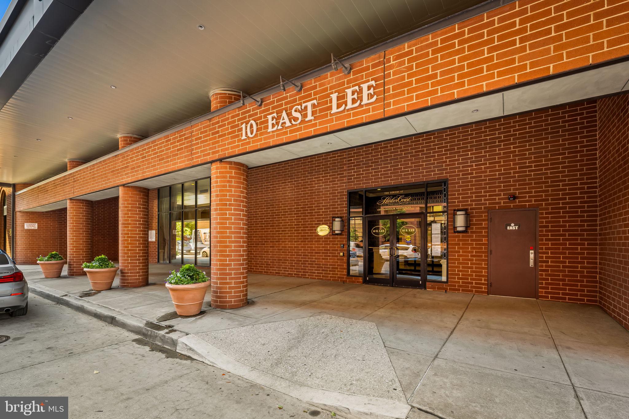10 East Lee Street, Unit 1103 Baltimore, MD 21202 - Photo 28 of 42 a view of a building with car parked