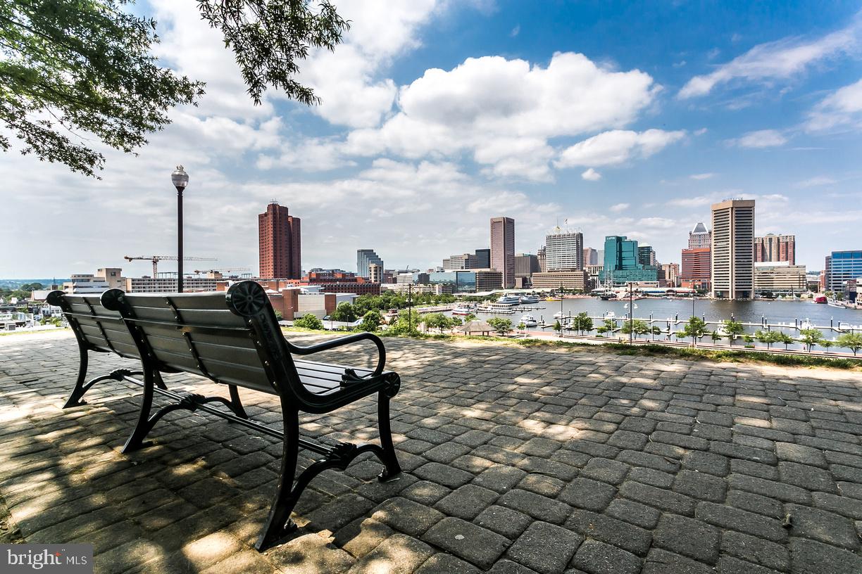 10 East Lee Street, Unit 1103 Baltimore, MD 21202 - Photo 32 of 42 a view of a terrace with sitting area