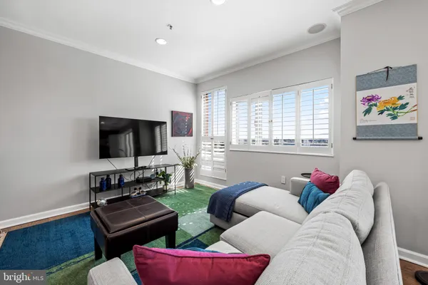 a living room with furniture workspace and a window