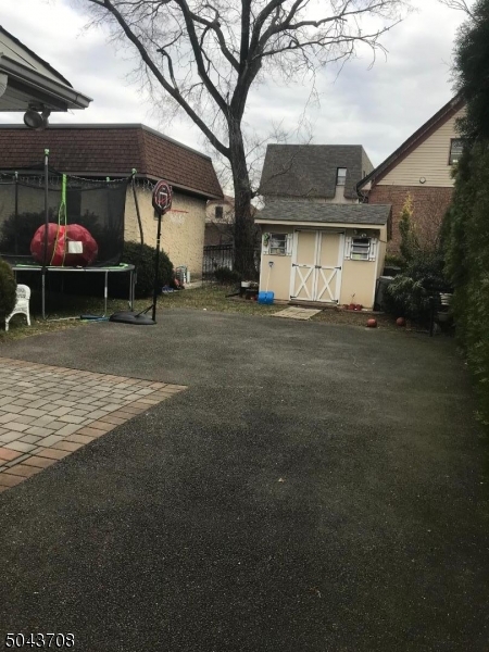 82 Cloverdale Road, Unit 1 Clifton, NJ 07013 - Photo 4 of 12 a view of a house with a yard