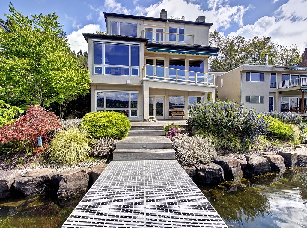 7023 Ripley Lane North Renton, WA 98056 - Photo 1 of 15 a front view of a house with a yard