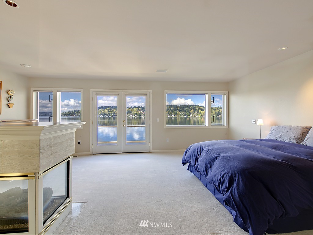 7023 Ripley Lane North Renton, WA 98056 - Photo 12 of 15 a bed sitting in a bedroom next to a window