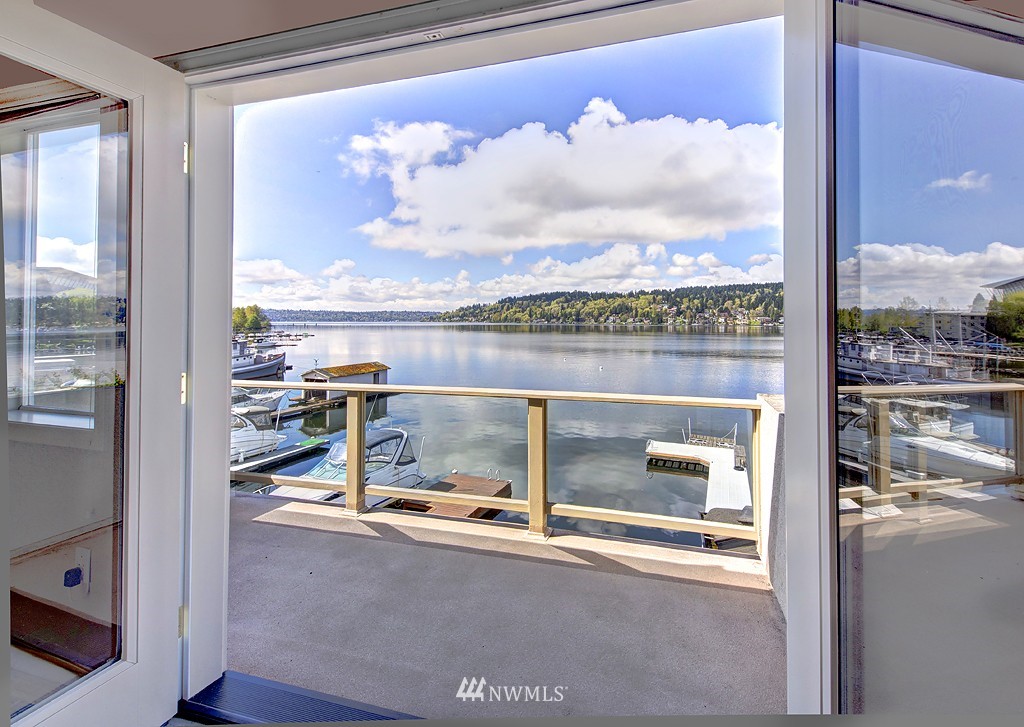 7023 Ripley Lane North Renton, WA 98056 - Photo 14 of 15 a view of a balcony with chair and front door