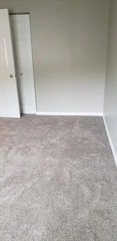 an empty room with a mirror