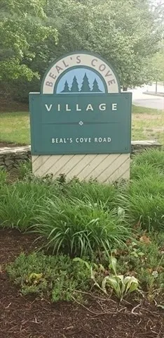 a view of a wooden fence next to a lake