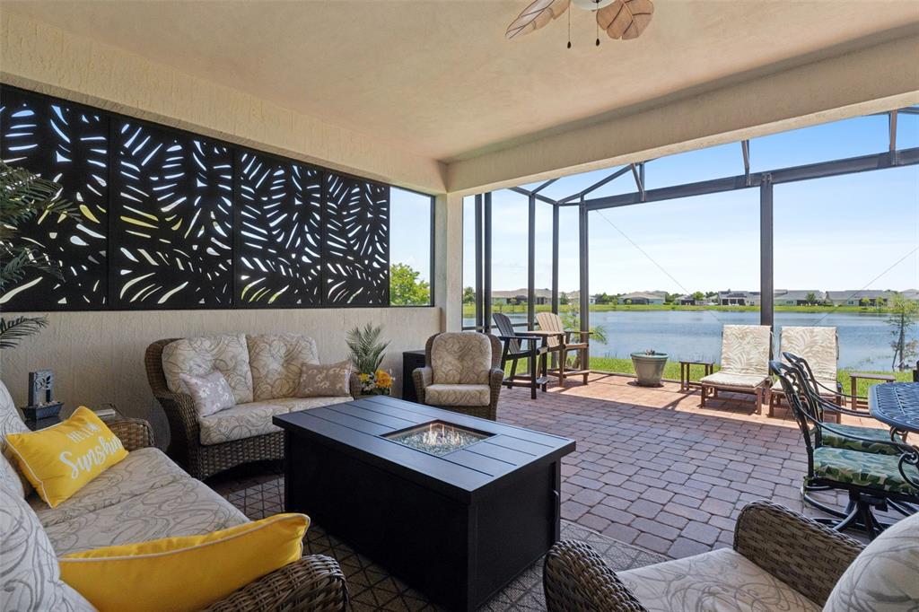 2665 Meadowedge Loop St. Cloud, FL 34772 - Photo 21 of 53 a living room with furniture and a floor to ceiling window