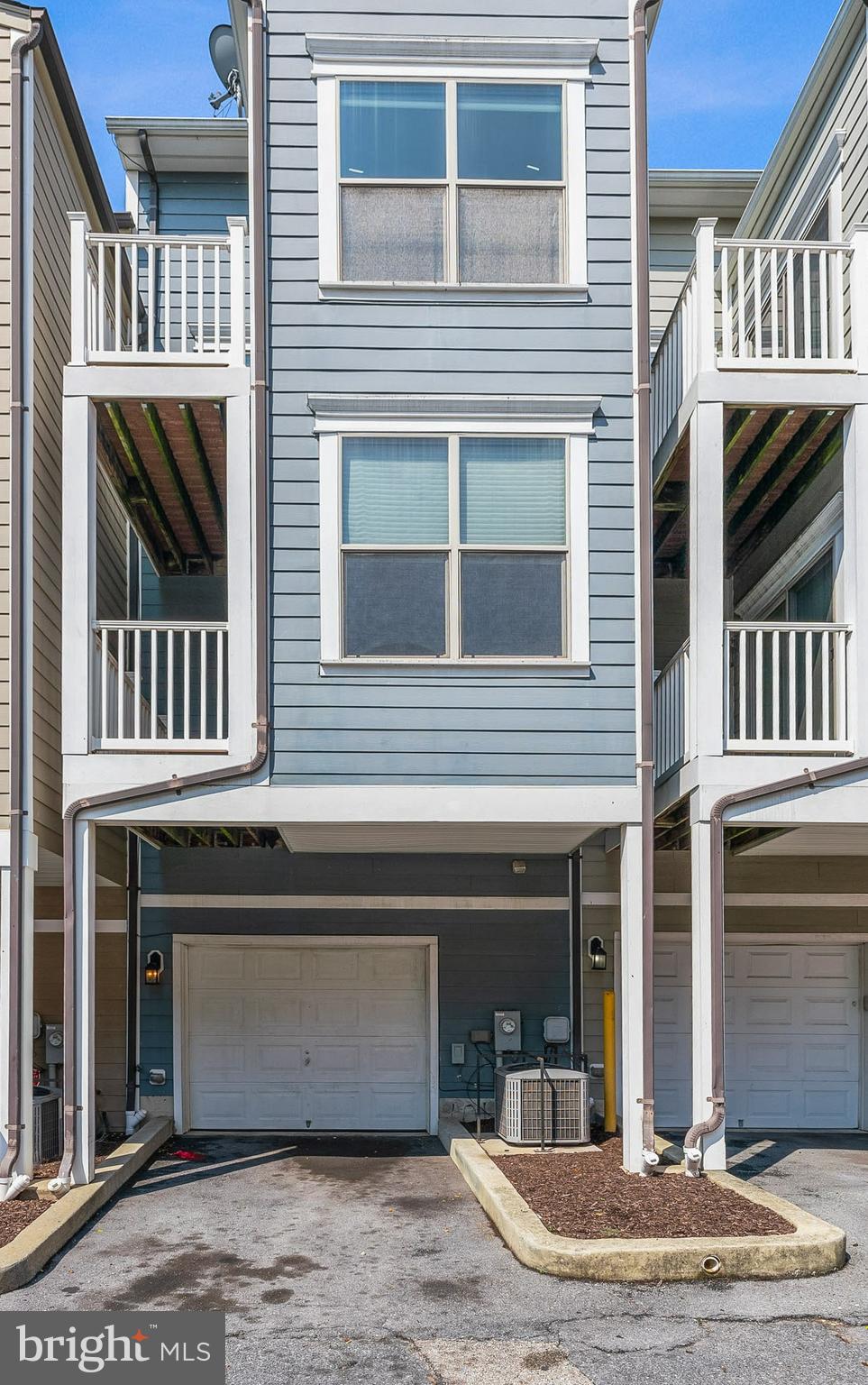 17 South Exeter Street, Unit 161 Baltimore, MD 21202 - Photo 2 of 27 a front view of a house with a yard