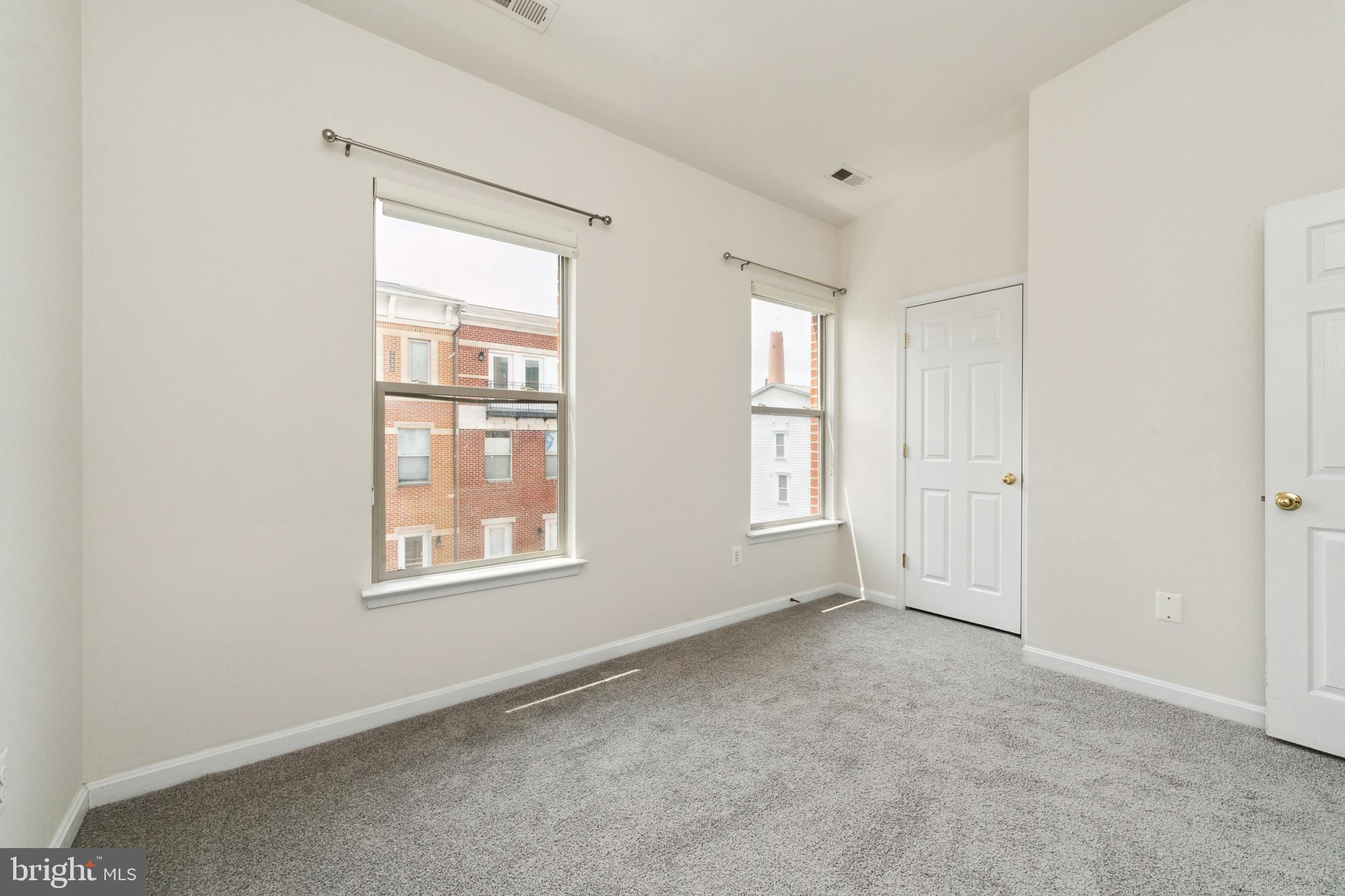 17 South Exeter Street, Unit 161 Baltimore, MD 21202 - Photo 21 of 27 an empty room with windows