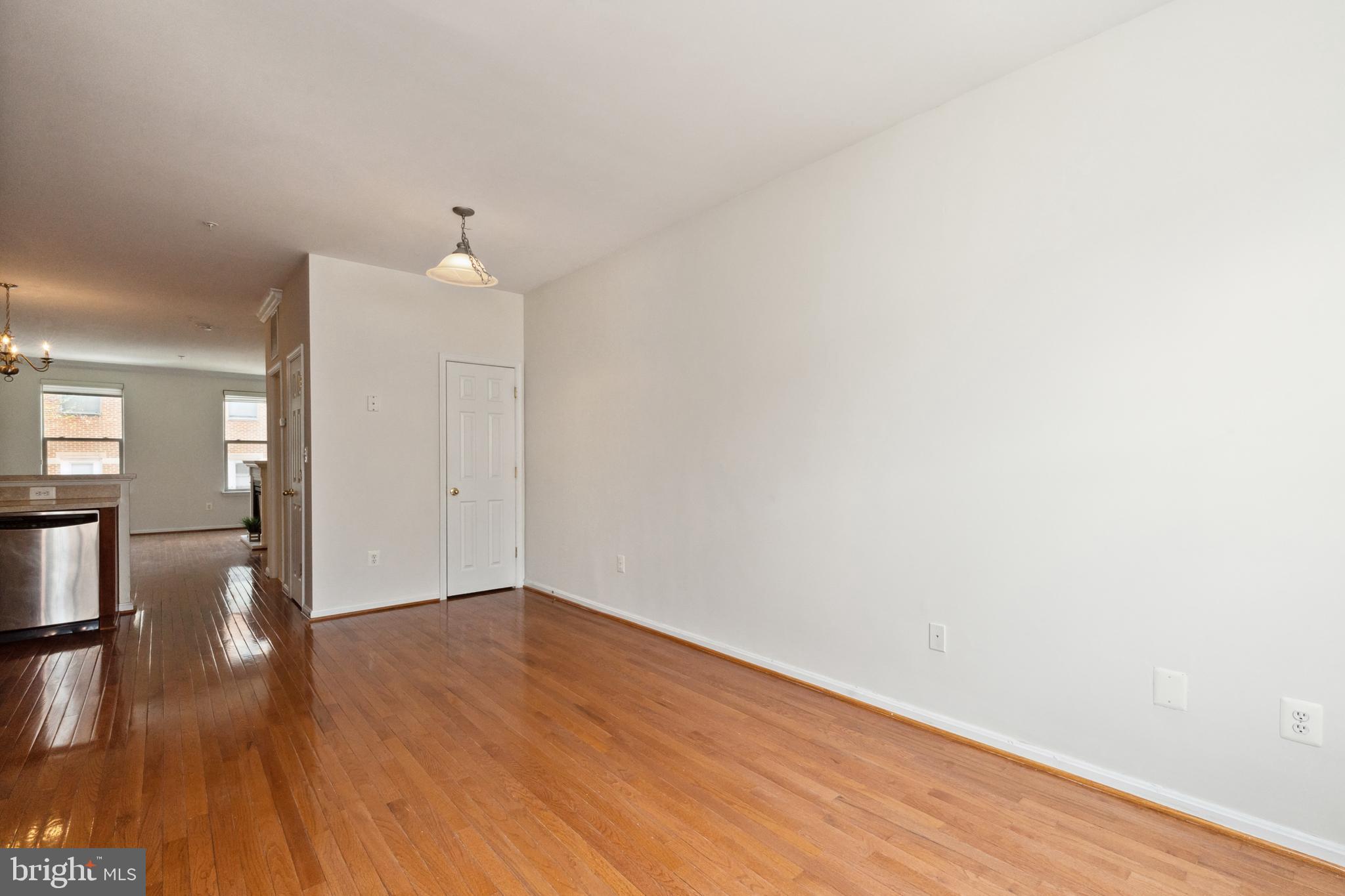 17 South Exeter Street, Unit 161 Baltimore, MD 21202 - Photo 9 of 27 wooden floor in an empty room