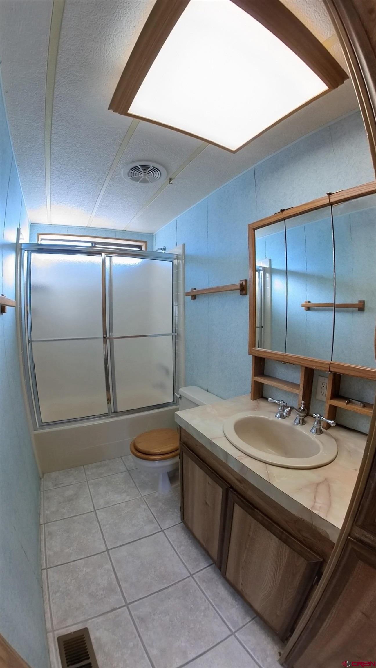 18865 Northridge Road Cedaredge, CO 81413 - Photo 16 of 23 a bathroom with a sink a toilet and mirror