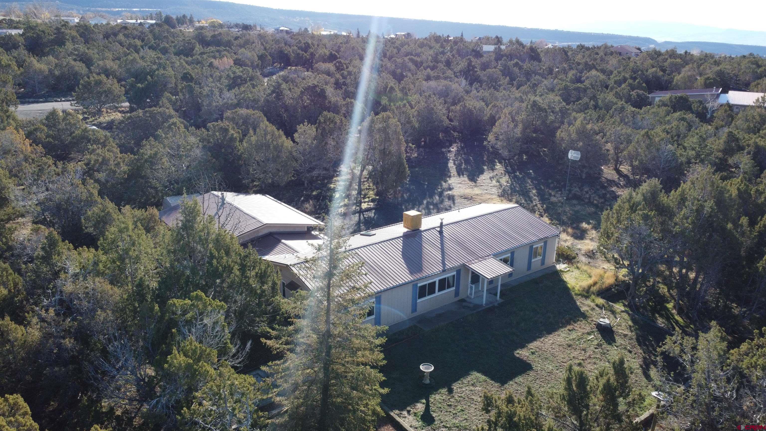 18865 Northridge Road Cedaredge, CO 81413 - Photo 17 of 23 an aerial view of house with yard