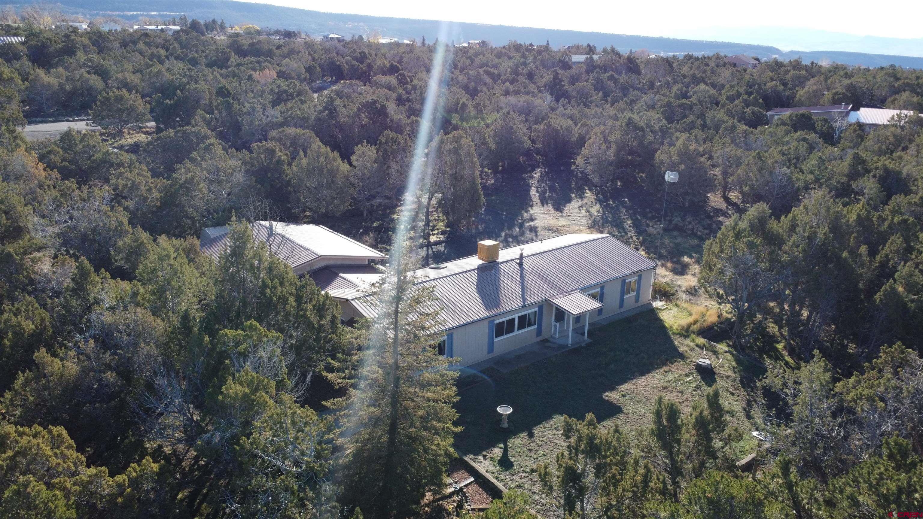 18865 Northridge Road Cedaredge, CO 81413 - Photo 19 of 23 an aerial view of house with outdoor space