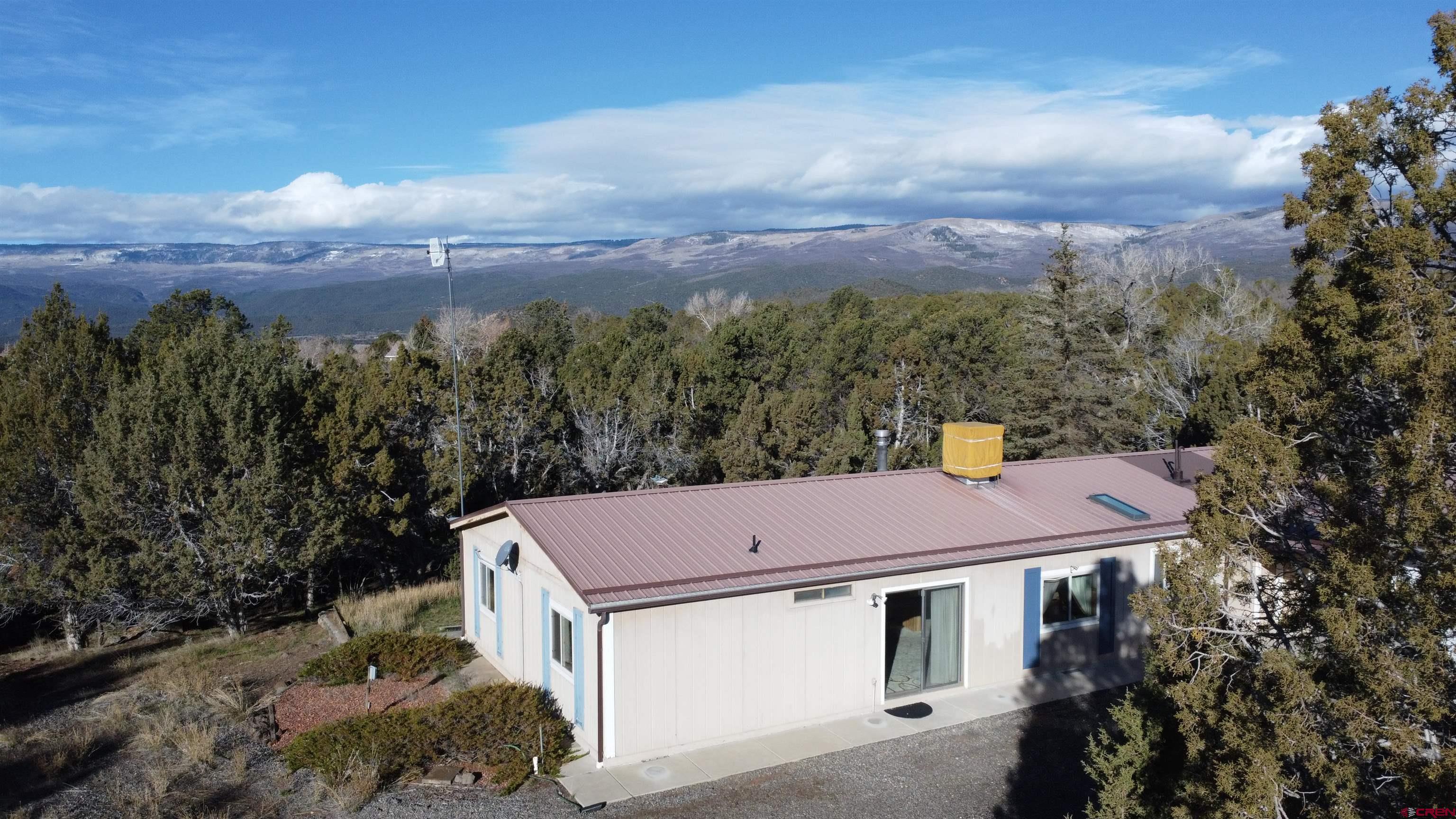 18865 Northridge Road Cedaredge, CO 81413 - Photo 22 of 23 a view of a yard in front of house
