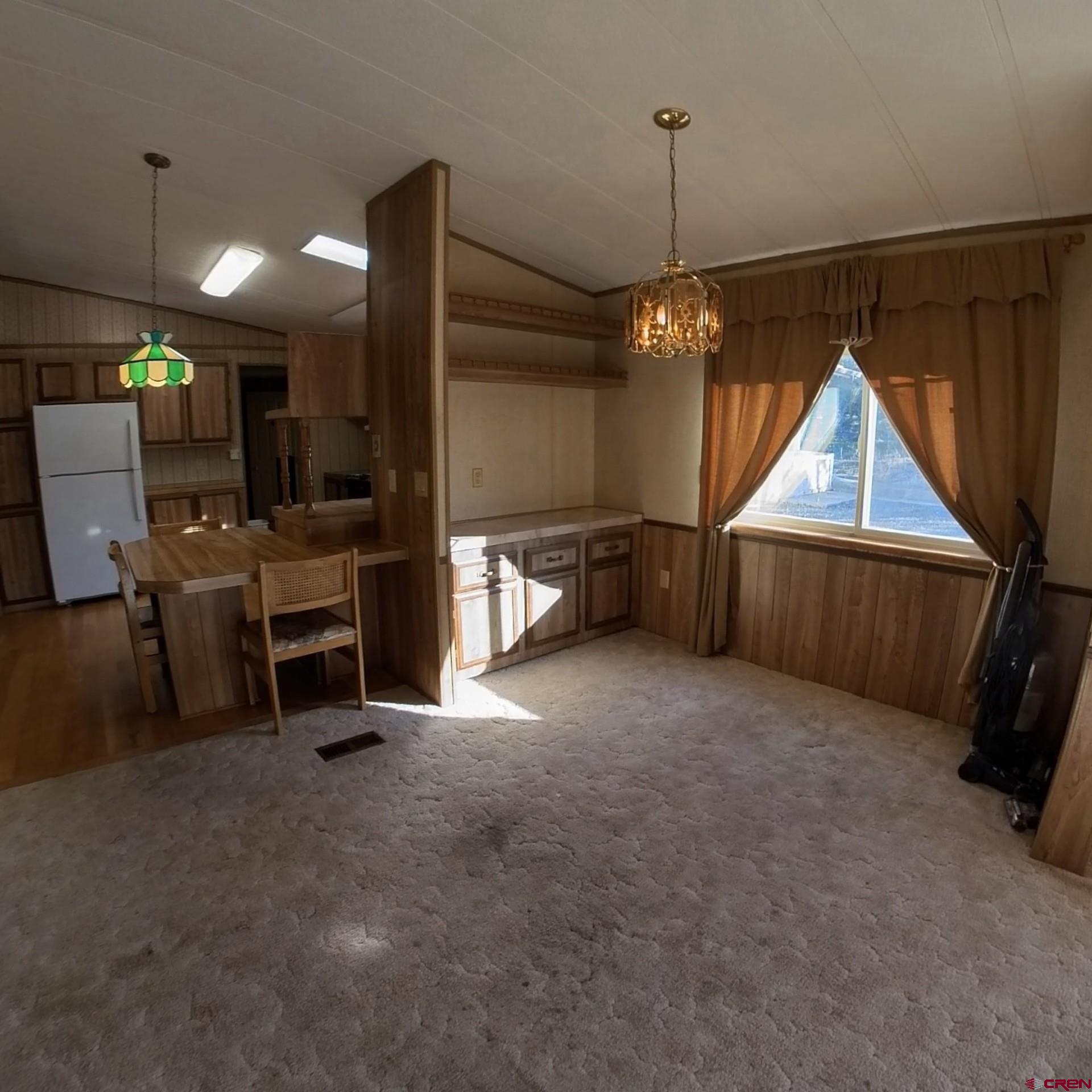 18865 Northridge Road Cedaredge, CO 81413 - Photo 8 of 23 a view of livingroom with furniture and chandelier