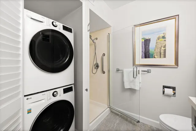 a view of a hallway with washer and dryer