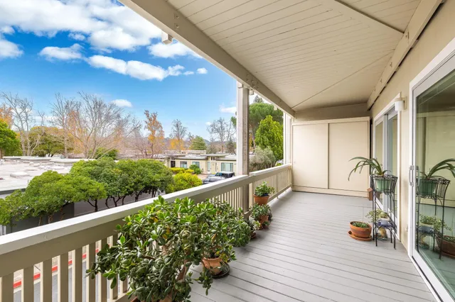 a view of a balcony with chairs