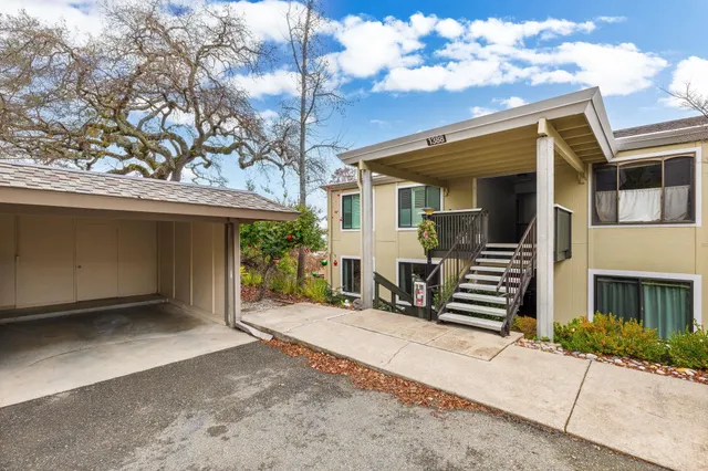 a front view of a house with stairs