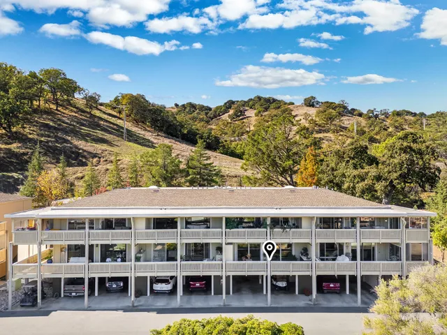 a view of houses with a street