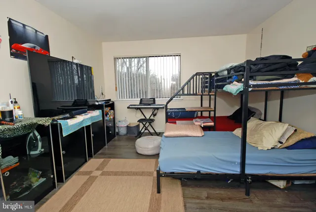 a living room with furniture a air conditioner and a window