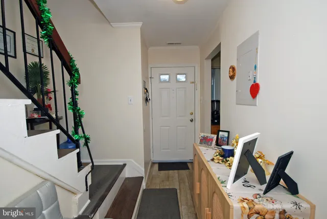 a view of a hallway with furniture and entryway
