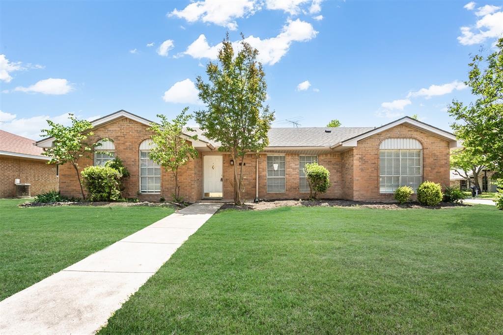 7102 Timberline Drive Rowlett, TX 75089 - Photo 1 of 1 Ranch-style house featuring brick siding and a front lawn