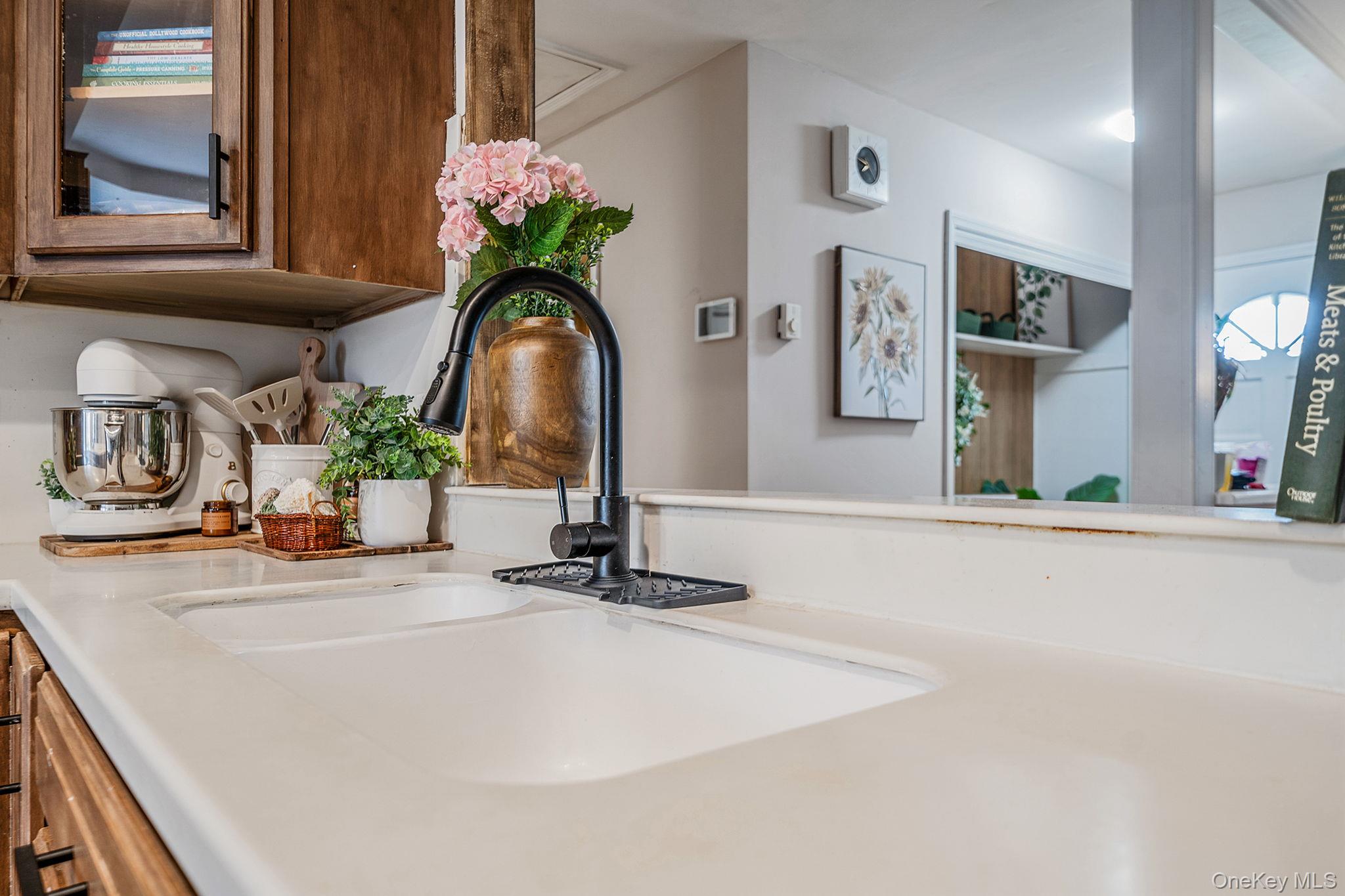 23 Wylde Road Mount Sinai, NY 11766 - Photo 13 of 45 a bathroom with a sink a vanity and a mirror