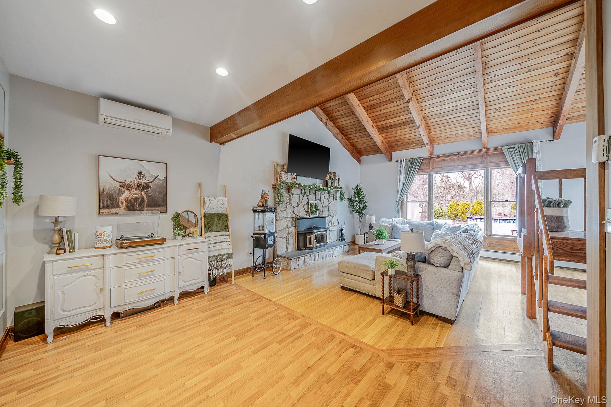 23 Wylde Road Mount Sinai, NY 11766 - Photo 14 of 45 a living room with furniture and a fireplace
