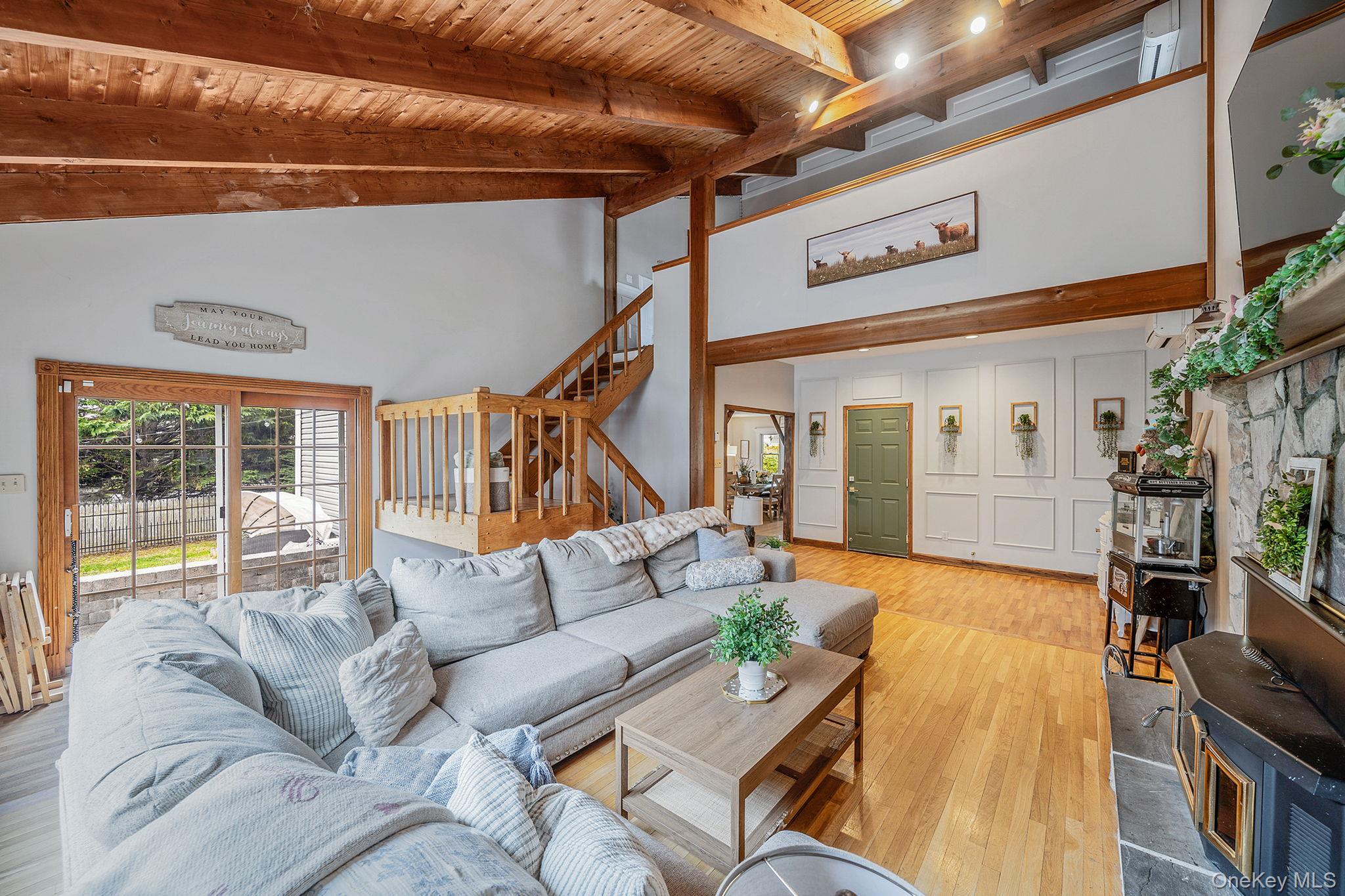 23 Wylde Road Mount Sinai, NY 11766 - Photo 15 of 45 a living room with furniture and a large window