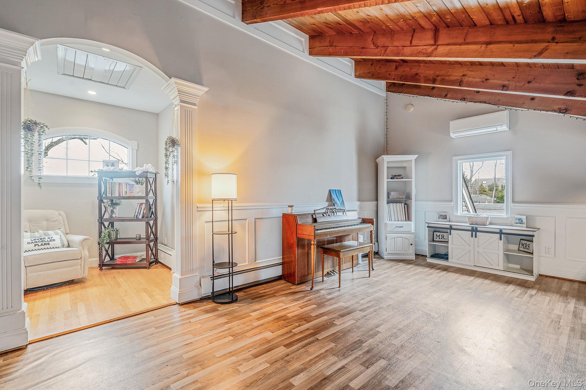 23 Wylde Road Mount Sinai, NY 11766 - Photo 18 of 45 a living room with furniture and a wooden floor