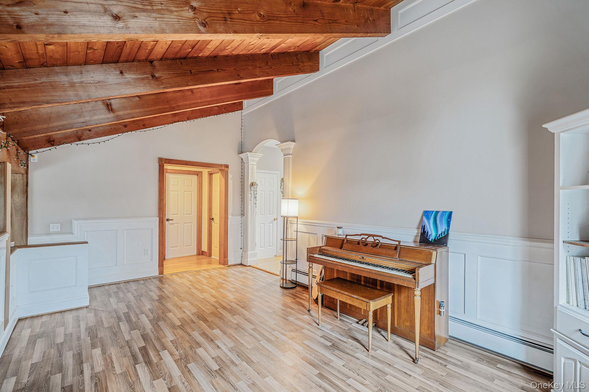 23 Wylde Road Mount Sinai, NY 11766 - Photo 19 of 45 a room with furniture and wooden floor