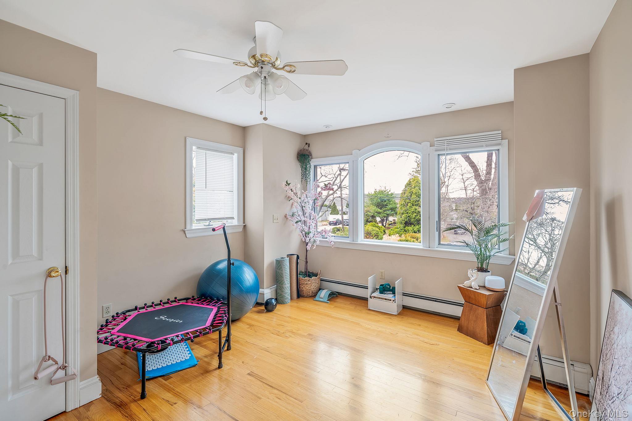 23 Wylde Road Mount Sinai, NY 11766 - Photo 20 of 45 a bedroom with furniture and a large window